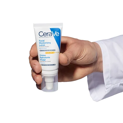 Hand holding CeraVe AM Moisturising Lotion with SPF